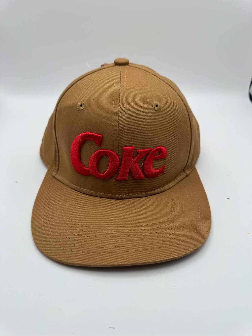 Brown Snapback Hat with Red 'Coke' Embroidery